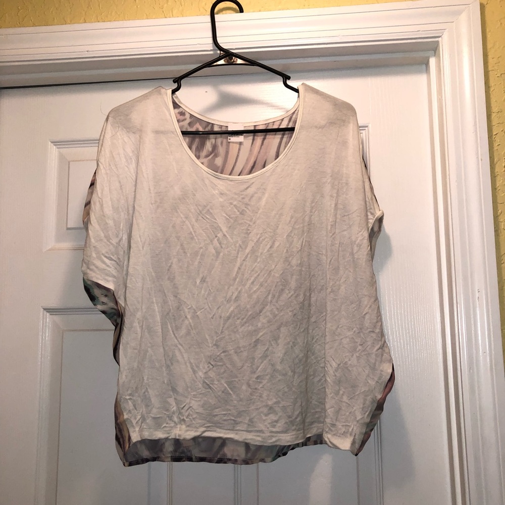 White shirt with colorful decorative back.